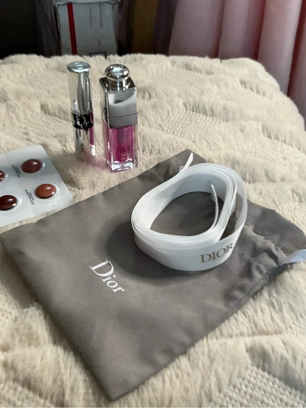 Dior White Logo Ribbon with Gray Pouch and Pink Lip Gloss Accent